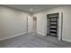 Finished basement bedroom featuring carpet, closet with shelves, and neutral paint at 20194 Robins Dr, Denver, CO 80249