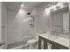 Updated bathroom with tiled shower, modern vanity, and updated fixtures at 20194 Robins Dr, Denver, CO 80249