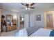 Bedroom with attached bathroom, closet and doorway leading to dining area at 20194 Robins Dr, Denver, CO 80249