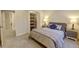 Bedroom includes closet, side tables, a bed, and a carpeted floor at 20194 Robins Dr, Denver, CO 80249