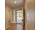 Inviting entryway featuring wood floors, coat rack and door to the front porch at 20194 Robins Dr, Denver, CO 80249