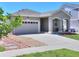 Charming single-story home featuring a well-kept front yard, and an attached two-car garage at 20194 Robins Dr, Denver, CO 80249