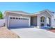 Charming single-story home featuring a well-kept front yard, and an attached two-car garage at 20194 Robins Dr, Denver, CO 80249