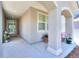 Inviting front porch with decorative pillars, plants, and a view of the front door at 20194 Robins Dr, Denver, CO 80249