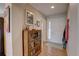 Entryway featuring hardwood floors and a wooden display case for books and collectibles at 20194 Robins Dr, Denver, CO 80249