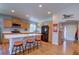 Bright kitchen featuring an island with bar seating, stainless steel appliances, and lots of cabinet space at 20194 Robins Dr, Denver, CO 80249