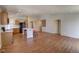 Open kitchen featuring a large island, stainless steel appliances, and hardwood floors at 20194 Robins Dr, Denver, CO 80249