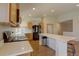 Well-lit kitchen features white countertops, stainless steel appliances, and wooden cabinets at 20194 Robins Dr, Denver, CO 80249