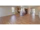 A spacious kitchen with stainless steel appliances, an island with bar seating and hardwood floors at 20194 Robins Dr, Denver, CO 80249