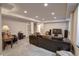 Spacious finished basement living room with recessed lighting, comfortable seating, and entertainment center at 20194 Robins Dr, Denver, CO 80249