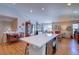 Spacious living area featuring an open kitchen, a dining area, and a comfortable living room at 20194 Robins Dr, Denver, CO 80249