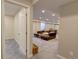 View from doorway to large finished basement living room with sectional couch at 20194 Robins Dr, Denver, CO 80249