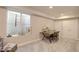 Home office in finished basement features egress window, desk, and carpeted floors at 20194 Robins Dr, Denver, CO 80249