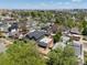 Aerial view showcases a residential neighborhood with tree-lined streets and diverse architecture at 3914 Osage St, Denver, CO 80211