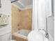 Tiled bathroom features a sink, toilet and jacuzzi bathtub shower combination at 3914 Osage St, Denver, CO 80211