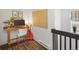 Bright home office nook with wood desk, guitar, and decor provides a cheerful workspace at 3914 Osage St, Denver, CO 80211