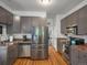 Modern kitchen with stainless steel appliances, updated cabinetry, and granite countertops at 3914 Osage St, Denver, CO 80211