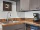Close-up of a kitchen sink featuring granite countertops and modern fixtures at 3914 Osage St, Denver, CO 80211