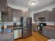 Well-equipped kitchen featuring stainless steel appliances and neutral cabinetry at 3914 Osage St, Denver, CO 80211