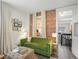 Comfortable living room featuring a green sofa and inviting decor at 3914 Osage St, Denver, CO 80211