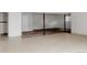 Basement featuring tile and carpet flooring and support beams at 12631 W Dakota Dr, Lakewood, CO 80228