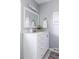 Clean, neutral bathroom featuring a single sink vanity with silver fixtures and bright lighting at 12631 W Dakota Dr, Lakewood, CO 80228