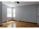 Light-filled bedroom with hardwood floors, neutral paint, and large windows offering plenty of natural light at 12631 W Dakota Dr, Lakewood, CO 80228