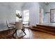 Cozy dining area with a round table, ample natural light, and a view of the front entrance at 12631 W Dakota Dr, Lakewood, CO 80228