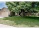 Inviting exterior of brick home with mature tree providing ample shade and attached garage at 12631 W Dakota Dr, Lakewood, CO 80228