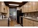 Well-equipped kitchen with ample cabinet space, modern appliances, and seamless transition to the breakfast nook at 12631 W Dakota Dr, Lakewood, CO 80228