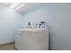 Bright laundry area featuring a side-by-side washer and dryer at 12631 W Dakota Dr, Lakewood, CO 80228