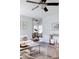 Open-concept living area with stylish decor, neutral tones, and a seamless flow to the dining area at 12631 W Dakota Dr, Lakewood, CO 80228