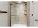 Glass shower enclosure with tile surround and showerhead at 12631 W Dakota Dr, Lakewood, CO 80228