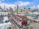 Aerial view of townhome community with patios and city views at 2350 Tremont Pl # 13, Denver, CO 80205