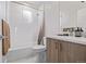 Well-lit bathroom featuring a shower-tub combo and a modern vanity at 2350 Tremont Pl # 13, Denver, CO 80205