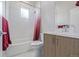 Well-lit bathroom featuring a shower-tub combo, modern vanity, and neutral color palette at 2350 Tremont Pl # 13, Denver, CO 80205