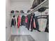 Well-organized closet space featuring motorcycle gear and a neutral color palette at 2350 Tremont Pl # 13, Denver, CO 80205
