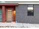 Contemporary home featuring a stylish front door, mixed materials and modern design at 2350 Tremont Pl # 13, Denver, CO 80205