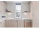 Contemporary kitchen featuring stainless steel appliances, a tiled backsplash and bright natural light at 2350 Tremont Pl # 13, Denver, CO 80205