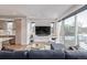 Bright living room with hardwood floors, an open layout, and a sleek entertainment area at 2350 Tremont Pl # 13, Denver, CO 80205