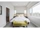 Bright main bedroom with large windows, ensuite bathroom, and modern furnishings at 2350 Tremont Pl # 13, Denver, CO 80205