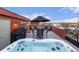 Inviting rooftop with a hot tub, BBQ, dining area, and fire pit for outdoor enjoyment at 2350 Tremont Pl # 13, Denver, CO 80205