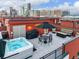 Enjoy this rooftop patio complete with a hot tub, grill, firepit, and views of the Denver skyline at 2350 Tremont Pl # 13, Denver, CO 80205