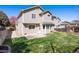 A well-maintained backyard with a grassy lawn, patio, and privacy fence that create a peaceful outdoor space at 13846 Harrison Dr, Thornton, CO 80602