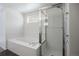 Bathroom with soaking tub and glass enclosed shower at 13846 Harrison Dr, Thornton, CO 80602