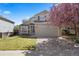 Charming two-story home with a well-maintained lawn and attached two car garage at 13846 Harrison Dr, Thornton, CO 80602