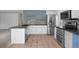 Well-equipped kitchen featuring stainless steel appliances and light-colored cabinets, perfect for cooking and entertaining at 13846 Harrison Dr, Thornton, CO 80602