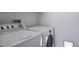 Laundry room featuring a white washer and dryer at 13846 Harrison Dr, Thornton, CO 80602