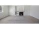 Inviting living room with a tiled fireplace, built-in shelves, and plenty of space at 13846 Harrison Dr, Thornton, CO 80602