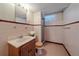 This bathroom features a single sink vanity with a shower at 4155 W Harvard Ave, Denver, CO 80219